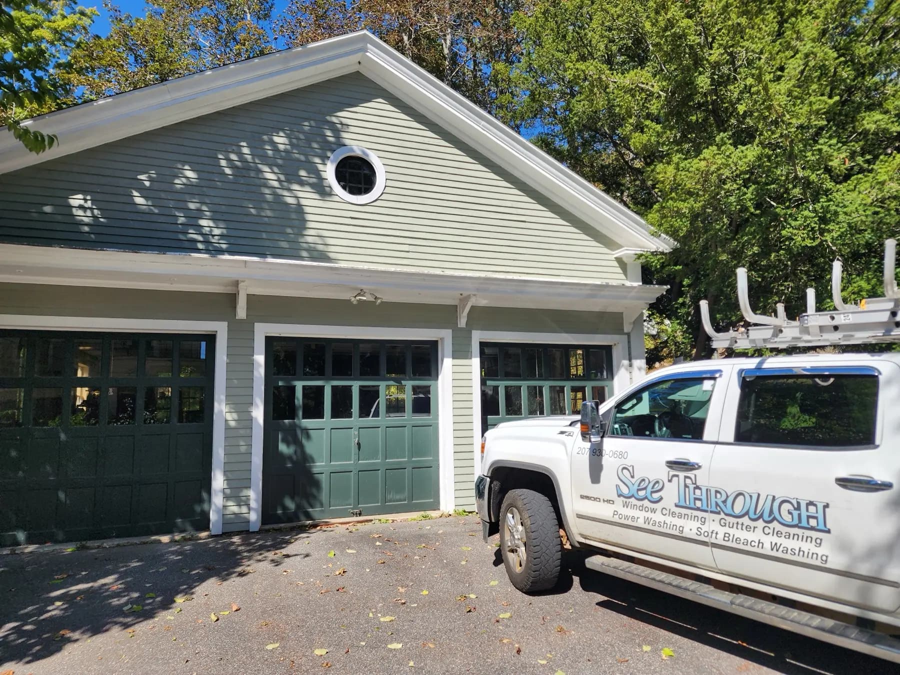 See Through truck parked beside a garage on a residential job